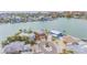 Stunning aerial view of waterfront homes, showcasing unique architecture and lush landscaping in a coastal setting at 16134 4Th E St, Redington Beach, FL 33708