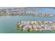 Waterfront home boasts a private boat dock, lush landscaping, and serene water views at 16134 4Th E St, Redington Beach, FL 33708