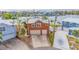 Aerial view of a two-story home with a two-car garage, surrounded by water at 16134 4Th E St, Redington Beach, FL 33708