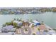 Aerial view of waterfront homes with lush landscaping and a view of the water at 16134 4Th E St, Redington Beach, FL 33708