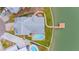 Overhead view of a home with a pool, dock, and manicured lawn at 16134 4Th E St, Redington Beach, FL 33708