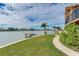 Well-manicured lawn and garden featuring a private dock overlooking waterfront at 16134 4Th E St, Redington Beach, FL 33708