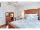 Bedroom with a wooden bed frame, white walls, and a white closet at 16134 4Th E St, Redington Beach, FL 33708