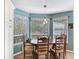 Dining nook with bay windows offers ample natural light and a cozy seating area at 16134 4Th E St, Redington Beach, FL 33708