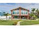 Home exterior with lush backyard, private pool, patio, and inviting curb appeal at 16134 4Th E St, Redington Beach, FL 33708