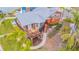 Stunning coastal home with an inviting deck, elegant landscaping, and a serene waterfront setting at 16134 4Th E St, Redington Beach, FL 33708