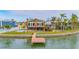 Charming waterfront home featuring a private dock, well-manicured yard, and refreshing pool at 16134 4Th E St, Redington Beach, FL 33708