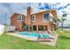 Exterior shot of home showcasing the private pool and expansive patio at 16134 4Th E St, Redington Beach, FL 33708
