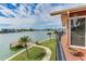 Exterior view from balcony, showing the lush lawn, walkway and personal boat dock at 16134 4Th E St, Redington Beach, FL 33708