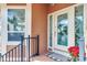 Elegant front door with decorative glass, complemented by a matching window and a small porch at 16134 4Th E St, Redington Beach, FL 33708