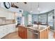 Spacious kitchen features stainless appliances, custom cabinetry, and an island with a breakfast bar at 16134 4Th E St, Redington Beach, FL 33708