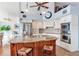 Modern kitchen featuring stainless steel appliances, a granite island, and custom cabinetry at 16134 4Th E St, Redington Beach, FL 33708
