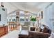 Bright living room with floor-to-ceiling windows and comfortable seating, perfect for relaxing and enjoying the views at 16134 4Th E St, Redington Beach, FL 33708