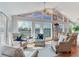 Bright living room featuring waterfront views, comfortable seating, and a ceiling fan at 16134 4Th E St, Redington Beach, FL 33708