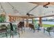 Outdoor living space featuring a waterfront view, bar, and comfortable seating, ideal for entertaining at 16134 4Th E St, Redington Beach, FL 33708