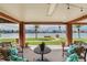 Relaxing outdoor area with comfortable seating, offering serene water views in a beautiful, covered space at 16134 4Th E St, Redington Beach, FL 33708