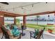 Cozy outdoor seating area with waterfront views, perfect for relaxing and enjoying the serene surroundings at 16134 4Th E St, Redington Beach, FL 33708