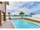 Inviting pool area offers the ultimate relaxation, featuring lounge chairs and waterfront views at 16134 4Th E St, Redington Beach, FL 33708