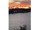 Beautiful water view with palm trees silhouetted against a fiery sunset at 16134 4Th E St, Redington Beach, FL 33708