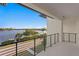 A balcony overlooks water and city views in the distance; it features black metal railings and a white ceiling at 337 Coffee Pot Ne Dr, St Petersburg, FL 33704