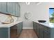 The bar area features custom cabinets, marble countertops, and a stylish mirror at 337 Coffee Pot Ne Dr, St Petersburg, FL 33704