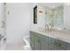 Bathroom features a custom vanity, marble walk-in shower, and modern lighting at 337 Coffee Pot Ne Dr, St Petersburg, FL 33704