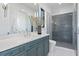 Elegant bathroom with dual-sink vanity, modern fixtures, and a glass-enclosed shower at 337 Coffee Pot Ne Dr, St Petersburg, FL 33704