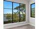 Bright bedroom with large windows overlooking the river and cityscape at 337 Coffee Pot Ne Dr, St Petersburg, FL 33704