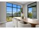 Dining room with large windows, neutral paint, modern lighting, and seating for eight at 337 Coffee Pot Ne Dr, St Petersburg, FL 33704