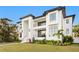 Contemporary architectural home with sleek lines, modern windows, landscaping, and meticulous lawn at 337 Coffee Pot Ne Dr, St Petersburg, FL 33704