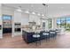 Gourmet kitchen with a large island, breakfast bar, custom lighting, and stainless steel appliances at 337 Coffee Pot Ne Dr, St Petersburg, FL 33704