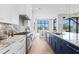 Modern kitchen showcasing a large island with seating and connecting to the view at 337 Coffee Pot Ne Dr, St Petersburg, FL 33704