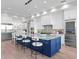 Gourmet kitchen with seating at the island, stainless steel appliances and modern cabinetry at 337 Coffee Pot Ne Dr, St Petersburg, FL 33704