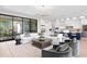 Open-concept living area with modern chandelier, comfortable seating, and sliding glass doors to outdoor space at 337 Coffee Pot Ne Dr, St Petersburg, FL 33704