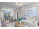 Upper level living room with modern lighting, decor, and comfortable seating at 337 Coffee Pot Ne Dr, St Petersburg, FL 33704