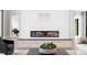 Elegant living room, white fireplace, and large windows overlooking a serene outdoor view at 337 Coffee Pot Ne Dr, St Petersburg, FL 33704