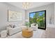 Bright living room featuring a large window, modern furniture, and elegant decor at 337 Coffee Pot Ne Dr, St Petersburg, FL 33704