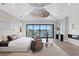 Bright main bedroom features a vaulted ceiling, contemporary furniture, and stunning water views at 337 Coffee Pot Ne Dr, St Petersburg, FL 33704