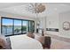 Elegant main bedroom with scenic water views, stylish decor, and cozy fireplace at 337 Coffee Pot Ne Dr, St Petersburg, FL 33704