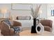 A close up of main bedroom with a bed, chairs and a round wooden coffee table at 337 Coffee Pot Ne Dr, St Petersburg, FL 33704