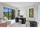 Stylish office space featuring a modern desk, comfortable seating, and large windows with leafy views at 337 Coffee Pot Ne Dr, St Petersburg, FL 33704
