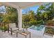 Inviting outdoor seating area by the pool, surrounded by lush landscaping, creates a private oasis at 337 Coffee Pot Ne Dr, St Petersburg, FL 33704