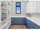 Butler's pantry features ample storage, custom cabinetry, and natural light at 337 Coffee Pot Ne Dr, St Petersburg, FL 33704