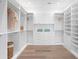 A walk-in closet with built-in shelving and drawers offers ample storage space at 337 Coffee Pot Ne Dr, St Petersburg, FL 33704