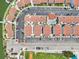 Birds-eye view of condo community with swimming pool, multiple residences, and manicured landscaping at 343 Rex Pl # F, Madeira Beach, FL 33708