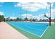 Community basketball court with well-marked lines and fencing, set in a tropical environment with palm trees at 343 Rex Pl # F, Madeira Beach, FL 33708