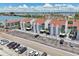 Attractive condo building featuring multi-level residences, private balconies, ample parking, and coastal charm at 343 Rex Pl # F, Madeira Beach, FL 33708