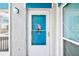 Charming front door detail, featuring an accent piece and ample sunlight at 343 Rex Pl # F, Madeira Beach, FL 33708