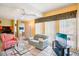 Comfortable living room with tile flooring, lots of natural light, and a television at 343 Rex Pl # F, Madeira Beach, FL 33708