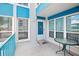 Cozy patio with blue accents, a decorative door piece, and ample sunlight at 343 Rex Pl # F, Madeira Beach, FL 33708